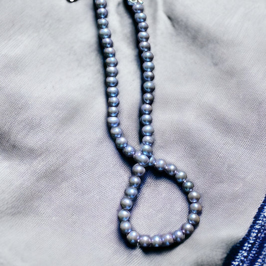 Lavender blue pearls on matching color silk,hand knotted with sterling silver handmade adjustable clasp 16-18” total length.